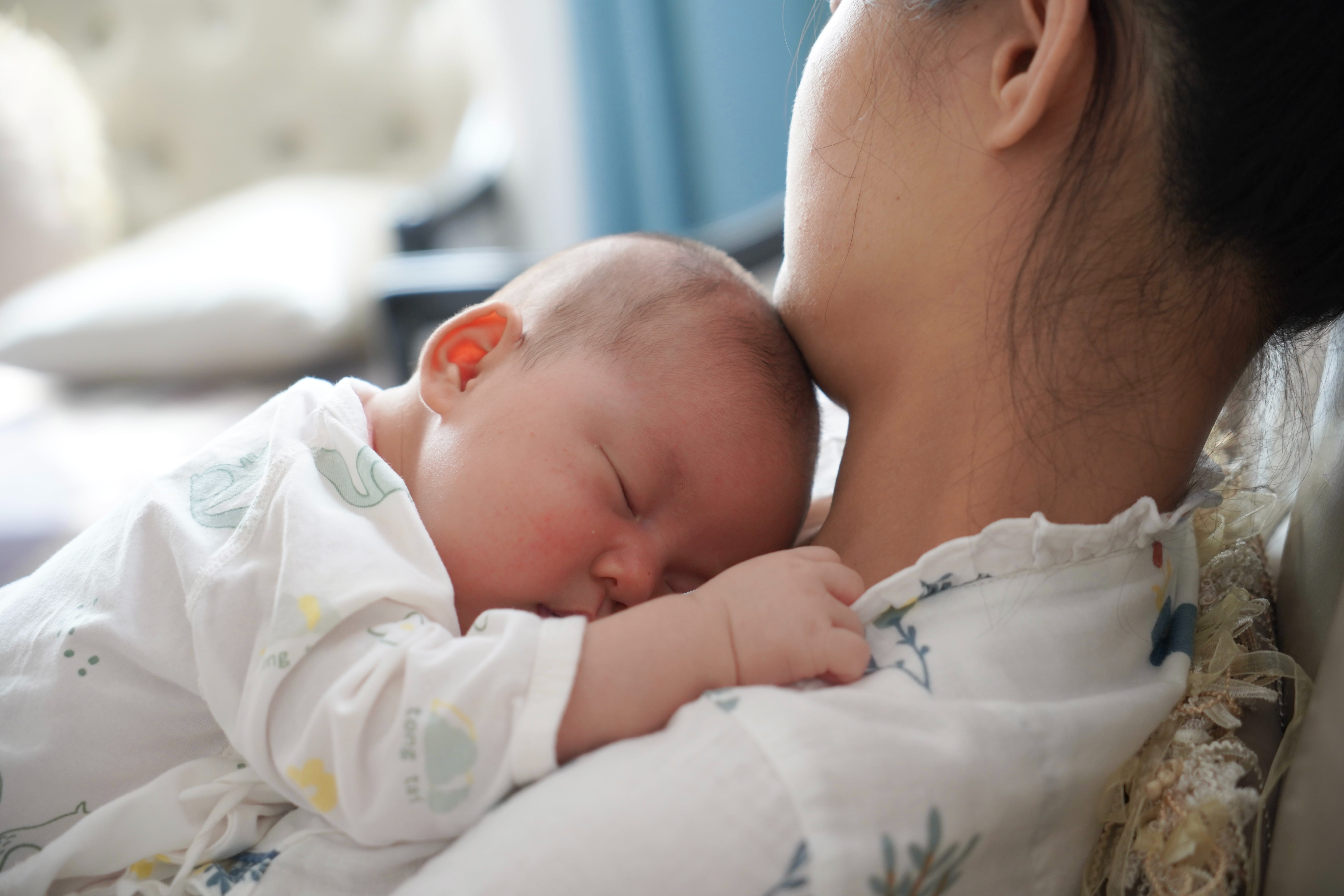 mom holding baby